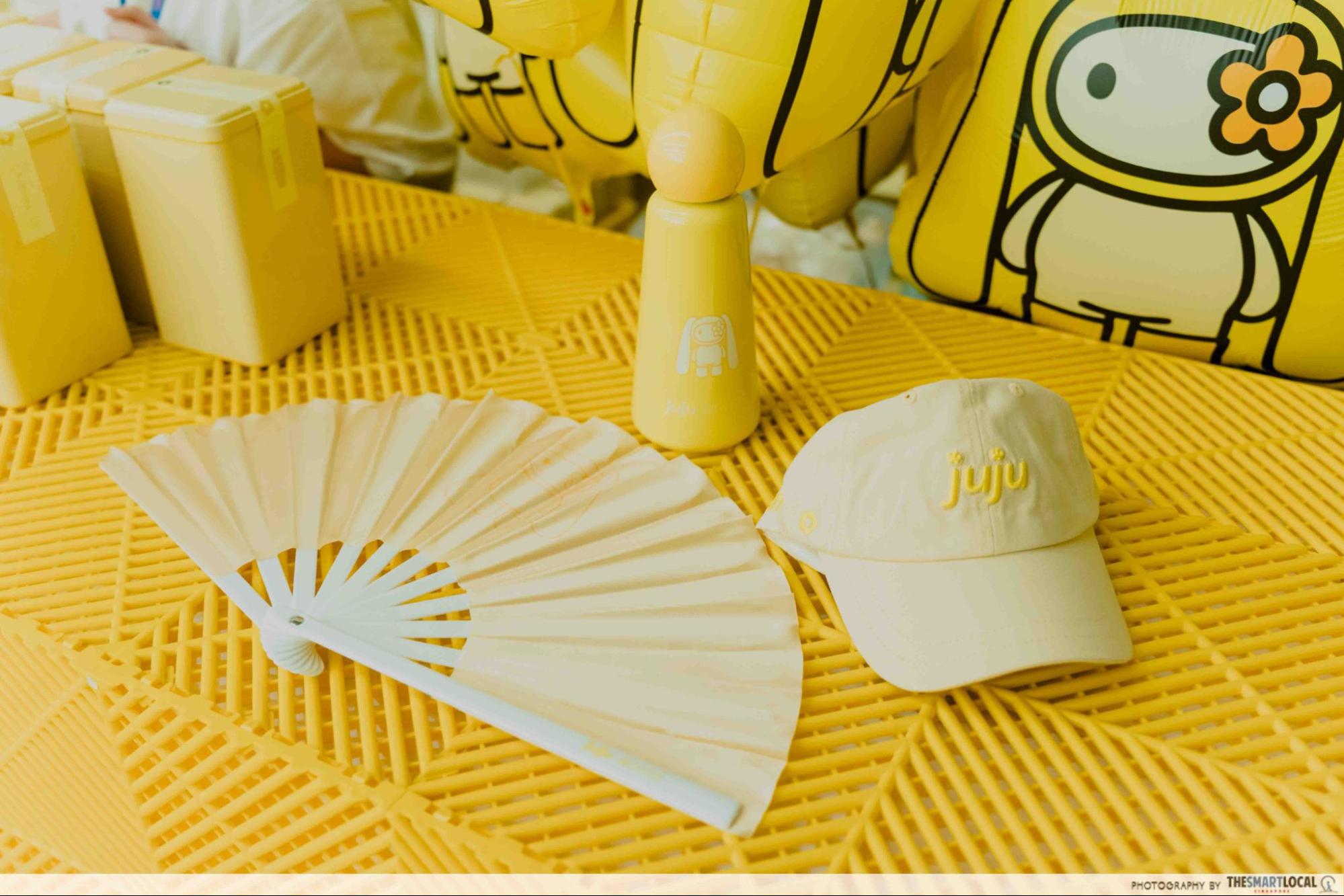 Fan, cap, and bottle juju merchandise