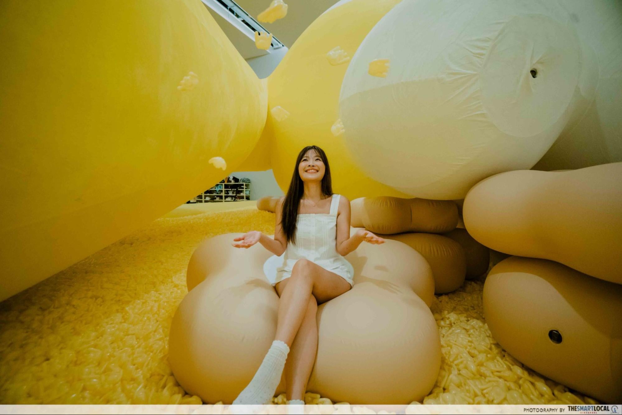 Sitting on inflatable flowers