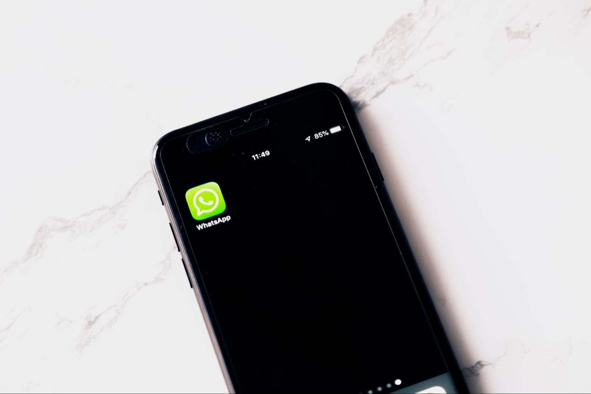 WhatsApp icon on a phone