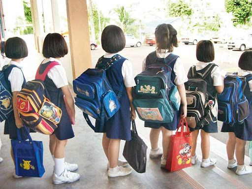 Kids carrying bags