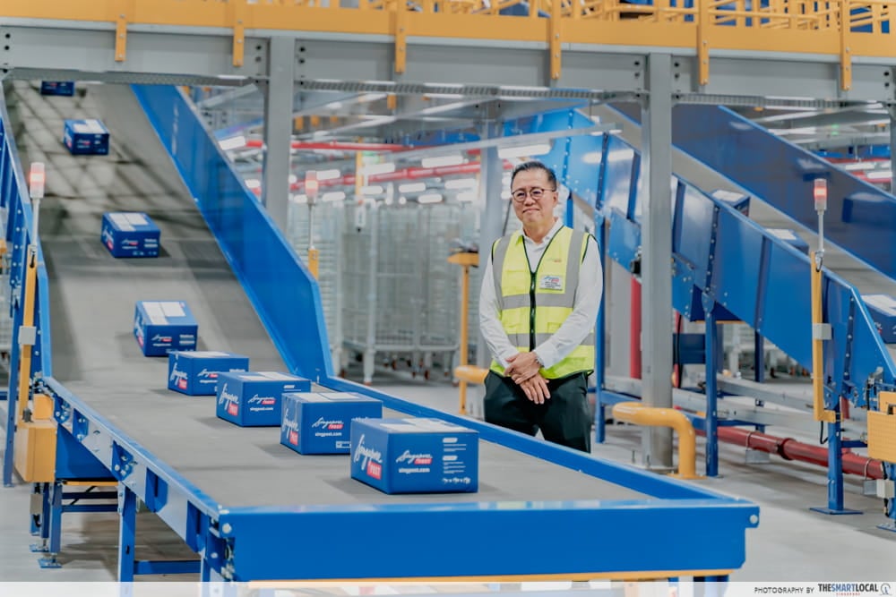 We Toured SingPost’s $30M Automated Parcel Facility For A BTS Look At How Our Parcels Reach Our Doorsteps - singpost ceo mark chong with intelligent flexi sorter
