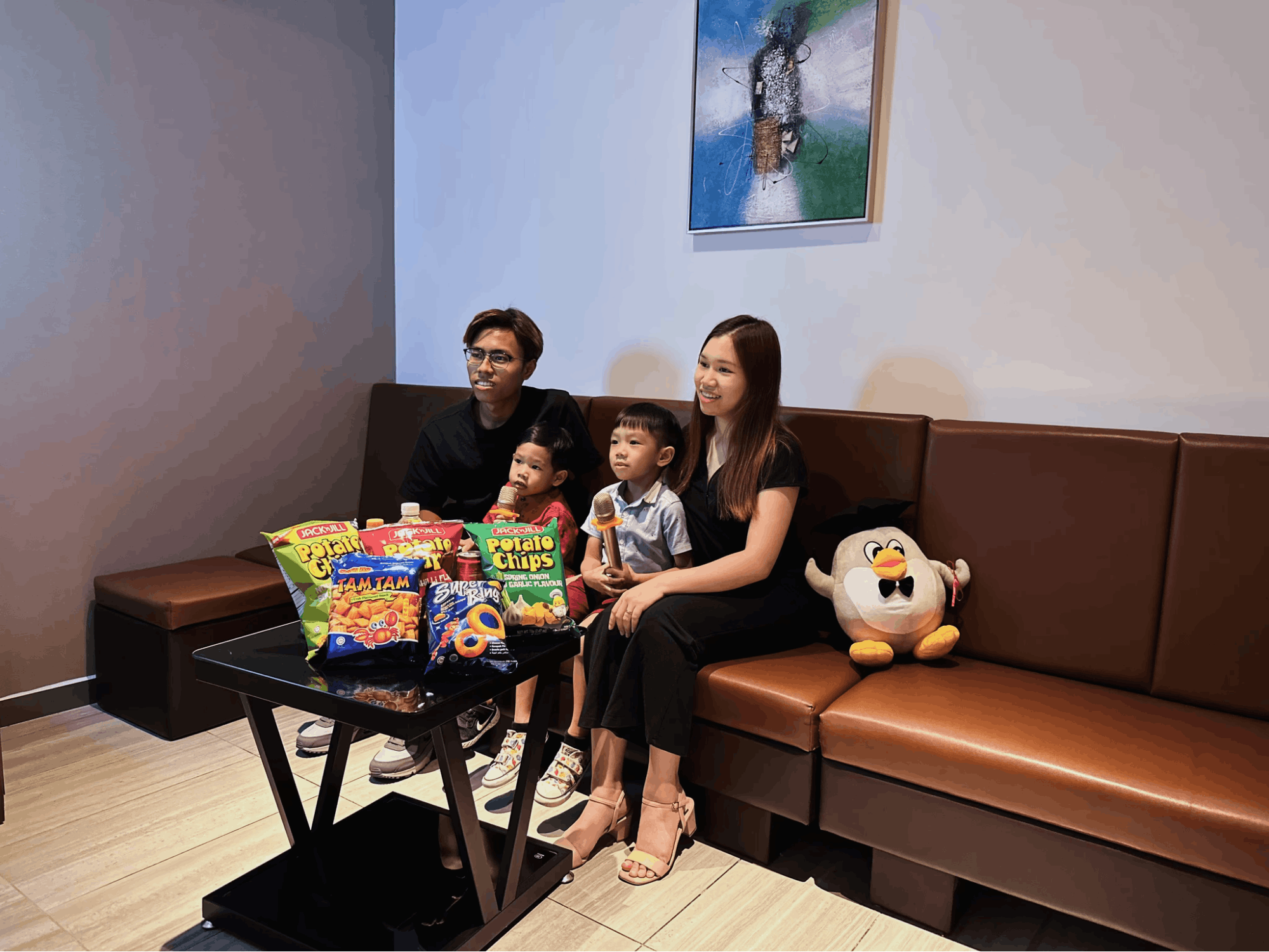 Family singing karaoke at Teo Heng