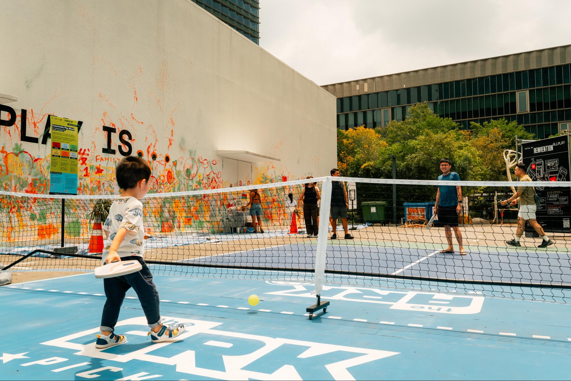 Kid playing pickleball